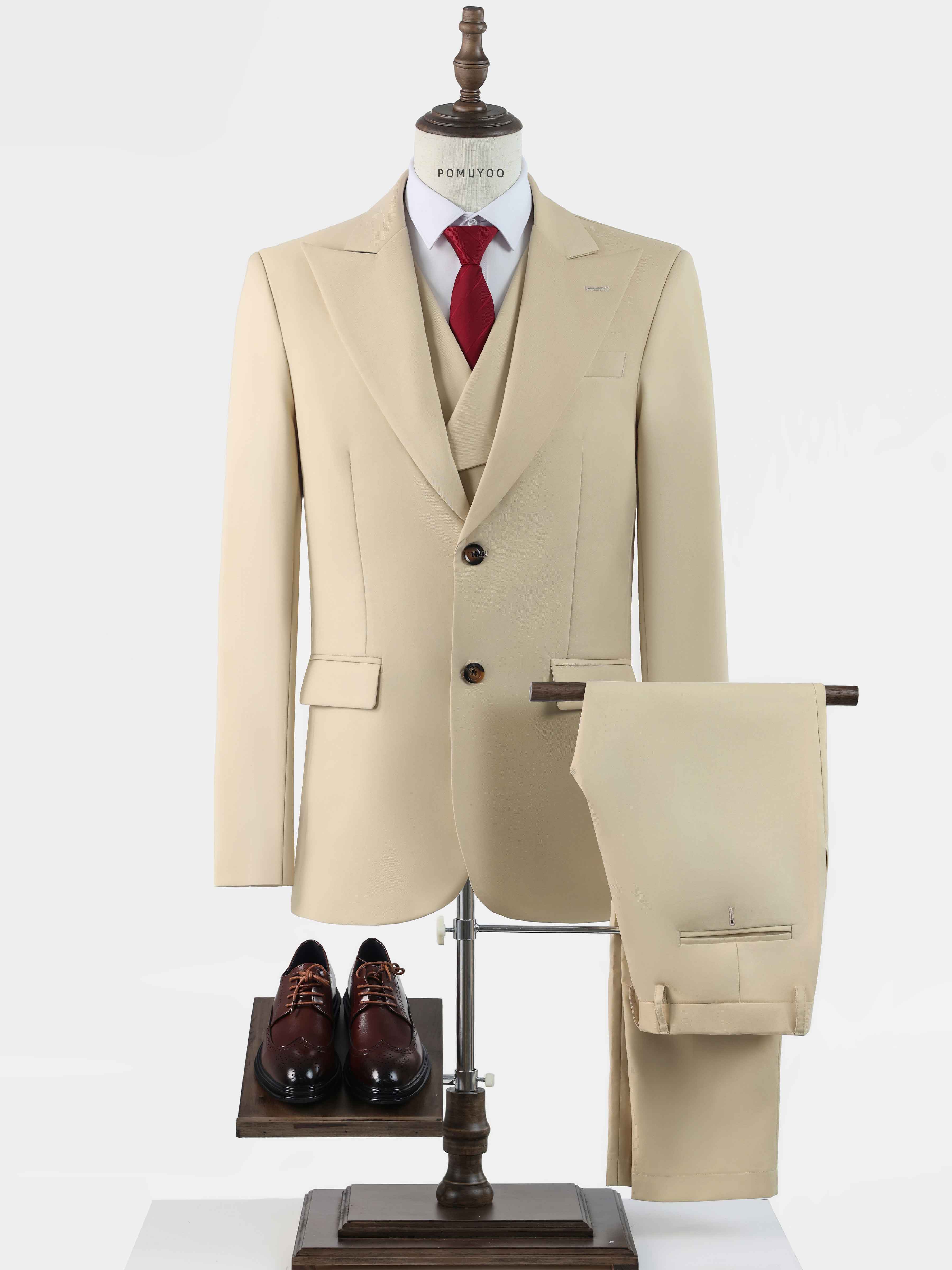Beige 3-piece men’s suit set with blazer, vest, pants, tie, and dress shoes displayed on mannequin
